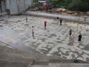 the soccer field-cement, and sometimes; wet