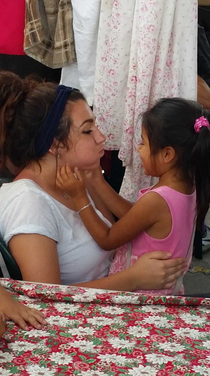 Madelyn with her friend, Chula, at the Sembradores lunch program. 